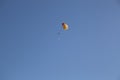 Parachutist in the blue sky