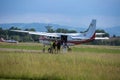 Parachutist Boarding inside White Piper Aircraft: Parachuting Training