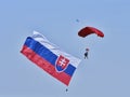 The parachutist flies with the Slovak flag behind him