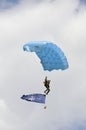 The parachutist goes down with the NATO flag