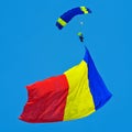 Parachutist with huge romanian flag ready to land - skydiving Royalty Free Stock Photo