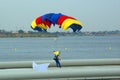 Parachutist landing on lake