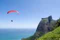 Parachutist over coast