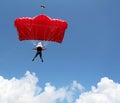 parachutist with red parachute on blue sky sport Royalty Free Stock Photo