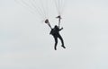 Parachutist in the sky on a cloudy day Royalty Free Stock Photo