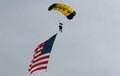 Parachutist in the sky on a cloudy day Royalty Free Stock Photo