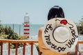 A woman on the shore of paracuru on a sunny day