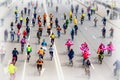 Parade of bicyclists in city. Youth and families with children participate in mass bicycle racing. Selective focus