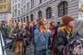A parade of Extinction Rebellion protesters with their hands painted red in a London street