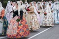 Parade of `Fallas` celebration group wearing traditional clothing and face masks for covid protection, Valencia, Spain