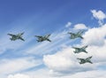 . Parade flight of aviation in the sky over Moscow. Group of Su-25 `Grach` attack aircraft