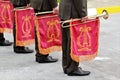 Parade of military orchestra holding musical instrument trumpet with red flag and golden lyre Royalty Free Stock Photo