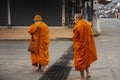 Parade of monks walking for received travelers and thai people respect praying put food and things offerings to monk at local Royalty Free Stock Photo