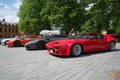Parade of rare sports cars in one of the squares of Turku, summer day