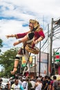 Parade on the street of Bali island. People carry a huge statue of a four-armed demon