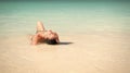 Paradisaic delight. Girl bikini lay relaxing turquoise ocean water lagoon. Woman on vacation relaxing in paradisiac Royalty Free Stock Photo