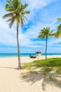 Paradise beach at Fort Lauderdale in Florida on a beautiful sumer day. Tropical beach with palms at white beach. USA Royalty Free Stock Photo