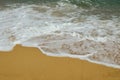 Paradise beach, golden sand, waves and sea foam