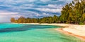 Paradise beach resort with palm trees and and tropical sea in Mauritius island. Summer vacation and tropical beach concept. Sandy Royalty Free Stock Photo