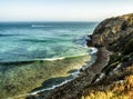 Paradise Cove Malibu, Zuma Beach, emerald and blue water in a quite paradise beach surrounded by cliffs. Malibu, Los Angeles, LA, Royalty Free Stock Photo