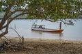 A Paradise island, tropical beach, emerald green sea with beach trees and blue sky background, Indonesia, south asia. Local people