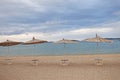 Empty beach before the storm, artistic wallpaper picture, bamboo umbrellas, Croatia, Dalmatia