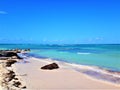 Paradise settings of a white sand speech and turquoise sea in Jamaica