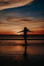 Paradise sunset woman silhouette. Perfect amazing travel destination in Indonesia, Bali, Kuta. Summer vacation concept