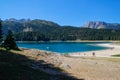 Paradise views of the national park Durmitor in Montenegro. Turquoise water of the lake, pine forest and mountains. Stunning backg Royalty Free Stock Photo