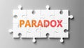 Paradox complex like a puzzle - pictured as word Paradox on a puzzle pieces to show that Paradox can be difficult and needs