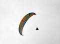 Paraglide flying through the sky on a white background Royalty Free Stock Photo