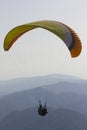 Paraglider above alpine mountains