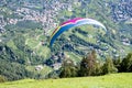 Paraglider above Dorf Tirol,  vacation resort with apple orchads, Tirol Castle, hiking trails, , Alto Adige, South Tyrol, Italy Royalty Free Stock Photo
