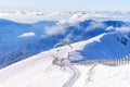 Paraglider on the background of snowy mountain peaks Royalty Free Stock Photo