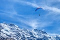 Paraglider in the blue sky. The sportsman flying on a paraglider