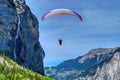 Paraglider in the blue sky. The sportsman flying on a paraglider