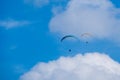 Paraglider flies in the air -Aerial view of paraglider above the clouds