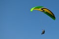 Paraglider flight through the blue sky Royalty Free Stock Photo