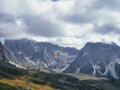 Paraglider in flight on the side of Mount Seceda in Dolomites, Italy