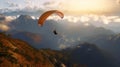 Paraglider floating over mountain ranges