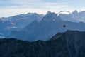 Paraglider flying above blue Mountains Silhouette, Allgaeu, Oberstdorf, Alps, Germany. Travel destination. Freedom and Royalty Free Stock Photo