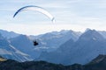 Paraglider flying above blue Mountains Silhouette, Allgaeu, Oberstdorf, Alps, Germany. Travel destination. Freedom and Royalty Free Stock Photo