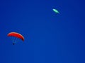 Paraglider flying with blue skies and moon