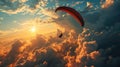 Paraglider flying in the blue sky with clouds at sunset