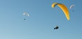 Paraglider flying in a blue sky Royalty Free Stock Photo