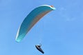 Paraglider flying in a blue sky Royalty Free Stock Photo