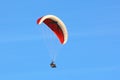 Paraglider flying in a blue sky Royalty Free Stock Photo