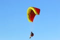 Paraglider flying in a blue sky Royalty Free Stock Photo