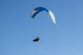 Paraglider flying in the blue sky. Italian Alps. Piedmont. Italy Royalty Free Stock Photo