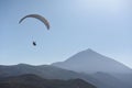 Paraglider flying in the blue sky with Mount Teide at the background.Tenerife, Canary Islands, Spain